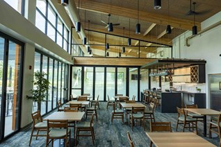Warm Springs Grill and Golf Exterior with tables and shades.
